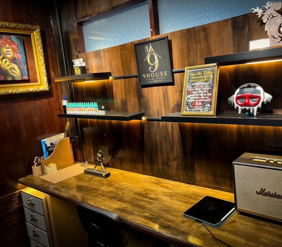 The office shelf with the Hua Hin certificate and studio objects