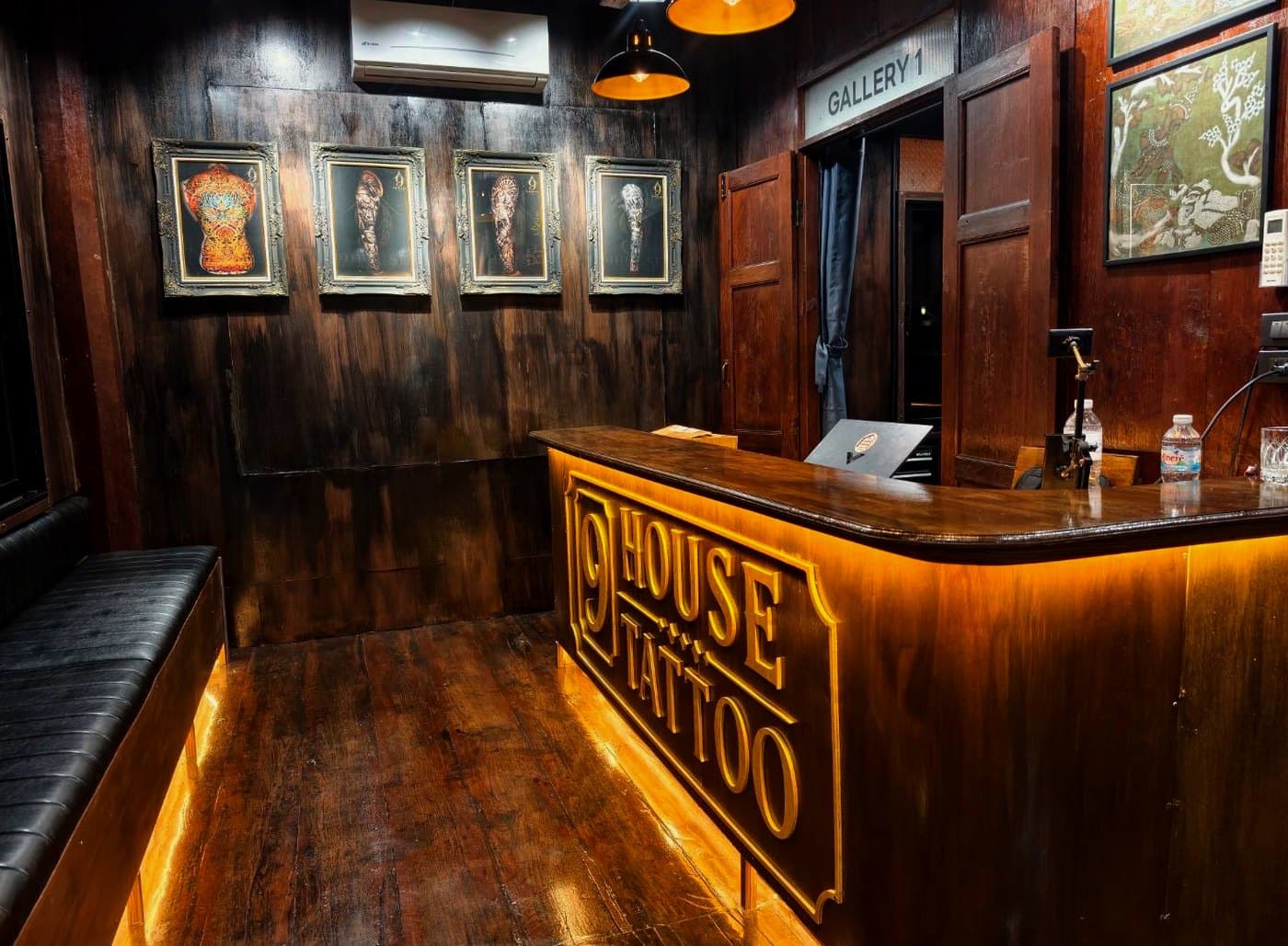 The reception at 9 House Tattoo, the desk cartouche lit